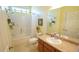 Bathroom featuring a shower-tub combo, wood vanity, framed mirror, and neutral walls at 201 Blithe Pl, Morrisville, NC 27560