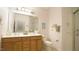 Well-lit bathroom featuring a double vanity, ample counter space, and a shower at 201 Blithe Pl, Morrisville, NC 27560