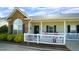 Charming townhouse featuring stone accents, a cozy front porch, and a well-maintained landscape at 201 Blithe Pl, Morrisville, NC 27560