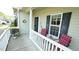 Inviting front porch with a seating area and charming decor, perfect for relaxing outdoors at 201 Blithe Pl, Morrisville, NC 27560
