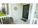 Cozy front porch featuring a welcome mat and decorative wreath, creating a warm and inviting entrance at 201 Blithe Pl, Morrisville, NC 27560