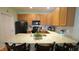 Bright kitchen with granite countertops, updated appliances, and a functional layout for cooking and entertaining at 201 Blithe Pl, Morrisville, NC 27560