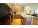 Functional kitchen layout featuring granite countertops, modern appliances, and a breakfast bar at 201 Blithe Pl, Morrisville, NC 27560