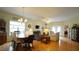 Inviting open-concept living and dining area with hardwood floors and natural light at 201 Blithe Pl, Morrisville, NC 27560