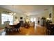 Open-concept living area with hardwood floors, a fireplace, and ample natural light at 201 Blithe Pl, Morrisville, NC 27560