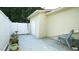 Back patio featuring a white privacy fence, green foliage, and space for seating at 201 Blithe Pl, Morrisville, NC 27560