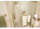 Beautiful walk-in shower with white tiling, a shower seat, and a mounted shower head at 201 Blithe Pl, Morrisville, NC 27560