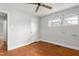 A simple bedroom features a closet, window, and hardwood floor at 229 Watson Dr, Burlington, NC 27217