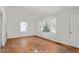 Spacious living room with hardwood floors, awaiting personalization at 229 Watson Dr, Burlington, NC 27217