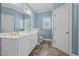 Light and bright bathroom offering a double vanity and lots of storage at 252 Shea Ct, Graham, NC 27253