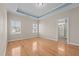 Spacious main bedroom with lots of natural light, ensuite bathroom, and hardwood floors at 252 Shea Ct, Graham, NC 27253