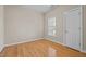 Cozy bedroom with neutral walls, wood floors, and a window to allow natural light in at 252 Shea Ct, Graham, NC 27253