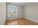 Bright bedroom features hardwood floors and a large arched window with natural light at 252 Shea Ct, Graham, NC 27253