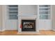Close-up of a fireplace with white mantel and built-in shelving at 252 Shea Ct, Graham, NC 27253