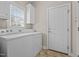 Functional laundry room with included washer and dryer and lots of natural light at 252 Shea Ct, Graham, NC 27253