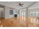 Bright living room with fireplace, built-in shelving, ceiling fan and hardwood floors at 252 Shea Ct, Graham, NC 27253