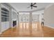 Spacious living room featuring a fireplace, built-in shelving, hardwood floors, and recessed lighting at 252 Shea Ct, Graham, NC 27253