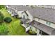 Aerial view of townhomes featuring covered patios, manicured lawns, privacy fences, and well-maintained roofs at 265 Mariah Towns Way, Garner, NC 27529