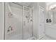Modern bathroom featuring a glass-enclosed shower and a bright vanity at 265 Mariah Towns Way, Garner, NC 27529