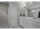 Elegant bathroom featuring a double sink vanity, marble countertops, and a walk-in shower at 265 Mariah Towns Way, Garner, NC 27529