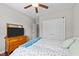 Comfortable bedroom featuring a dresser, ceiling fan, and natural light at 265 Mariah Towns Way, Garner, NC 27529
