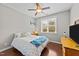 Cozy bedroom with a ceiling fan, hardwood floors, and a bright window at 265 Mariah Towns Way, Garner, NC 27529