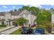 Attractive townhome with a two-car garage and well-kept landscaping on a sunny day at 265 Mariah Towns Way, Garner, NC 27529