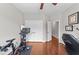 Bright workout room with hardwood floors and a Peloton exercise bike at 265 Mariah Towns Way, Garner, NC 27529
