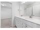 Bright bathroom with double vanity, white cabinets, and modern fixtures at 2920 Huxley Way, Apex, NC 27502