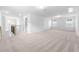 Expansive bonus room with neutral carpet and ample natural light from multiple windows at 2920 Huxley Way, Apex, NC 27502