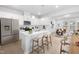 Bright kitchen with stainless steel appliances, white cabinetry, and a central island with seating at 2920 Huxley Way, Apex, NC 27502