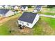 An aerial view shows the rear of the home and its surrounding yard at 295 Springtooth Dr, Zebulon, NC 27597