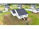 An aerial view displays the home's backyard with a patio and outdoor seating at 295 Springtooth Dr, Zebulon, NC 27597