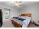 Bedroom with access to bathroom with natural light and neutral colors at 295 Springtooth Dr, Zebulon, NC 27597
