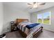 Comfortable bedroom with natural light, neutral colors, and a ceiling fan at 295 Springtooth Dr, Zebulon, NC 27597