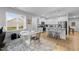 Bright kitchen featuring modern appliances, granite countertops, and bar stool seating at 295 Springtooth Dr, Zebulon, NC 27597