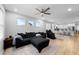 Bright and spacious living room with large windows, open floor plan and comfortable seating at 295 Springtooth Dr, Zebulon, NC 27597