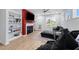 Open living area with a cozy sectional sofa, fireplace, and built-in shelving at 295 Springtooth Dr, Zebulon, NC 27597