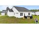 An aerial view shows the back of the house with outdoor furniture at 295 Springtooth Dr, Zebulon, NC 27597