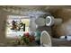 Bathroom featuring a toilet, sink, and window with decorative floral arrangements at 308 San-Lee Drive Dr, Sanford, NC 27330