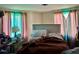 Bedroom featuring a bed with a gray headboard and two windows with drapes at 308 San-Lee Drive Dr, Sanford, NC 27330