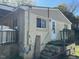 Exterior view with white door and steps to a small deck at 308 San-Lee Drive Dr, Sanford, NC 27330