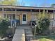 Charming covered front porch with seating area, accessible via wooden ramp and steps at 308 San-Lee Drive Dr, Sanford, NC 27330