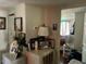 Hallway with vintage decor, shelving, and an open doorway leading to the bedroom at 308 San-Lee Drive Dr, Sanford, NC 27330