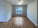 Bright bedroom with a ceiling fan and a window overlooking the neighborhood at 312 Sarazen Dr, Clayton, NC 27527
