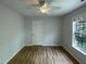 Cozy bedroom features a ceiling fan and ample natural light from the window at 312 Sarazen Dr, Clayton, NC 27527