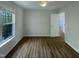 Well-lit bedroom with ceiling fan and large window offers a comfortable space at 312 Sarazen Dr, Clayton, NC 27527