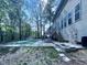 A backyard pool with deck access surrounded by lush greenery; a serene outdoor retreat at 312 Sarazen Dr, Clayton, NC 27527