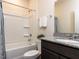 Clean bathroom featuring a shower-tub combo, granite vanity, and modern fixtures at 3521 Strawberry Patch Row, Raleigh, NC 27604
