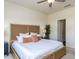 Cozy bedroom with a woven headboard, neutral tones, and soft, inviting textures at 3521 Strawberry Patch Row, Raleigh, NC 27604